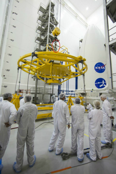 Clean room at NASA crane rigging prepared for lift of large capsule