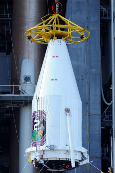 A capsule being craned into place prior to launch